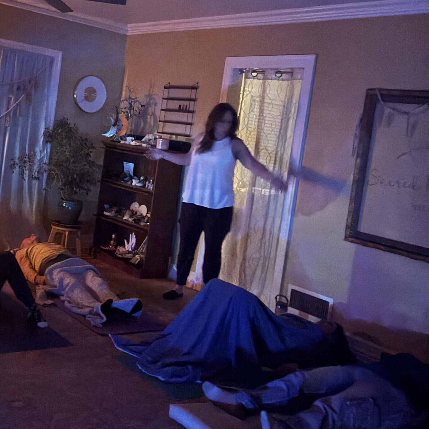 Room with people lying on the floor.